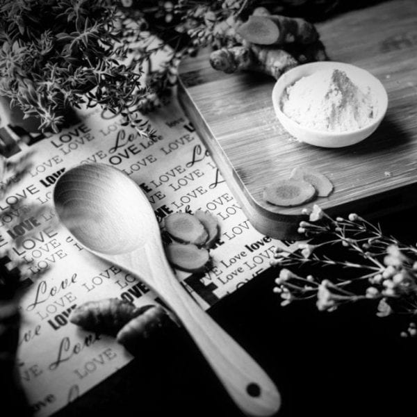 Wooden spoon and herbs